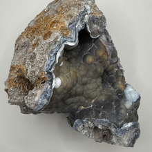 Load image into Gallery viewer, HUGE Grey & Purple Agatized Coral Geode