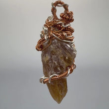 Load and play video in Gallery viewer, Amber Wire Wrapped Florida Calcite Crystal Pendant - Nature Inspired