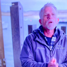 Load image into Gallery viewer, Producer, cameraman and shark diver Mark Rackley on his episode of Shark Week called "Monsters of the Cape" wearing his own SHRKco jacket!