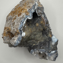 Load image into Gallery viewer, HUGE Grey &amp; Purple Agatized Coral Geode
